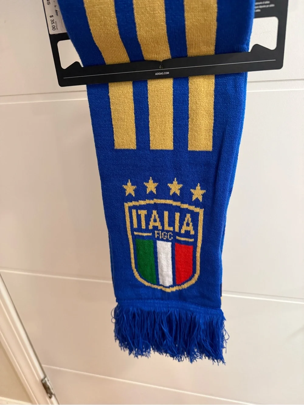 This is an Adidas Italy 26 scarf in Bold Blue and Hazy Beige